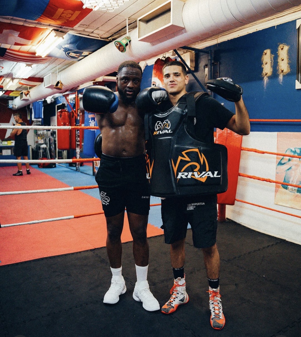 Ruben holding pads with Skip2Fame in the boxing gym