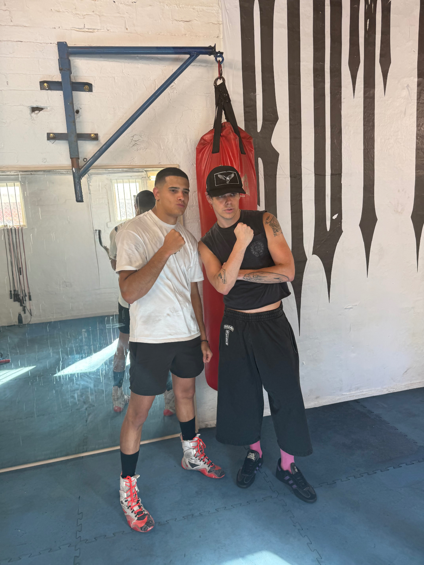 Ruben and YUNGBLUD posing in the boxing gym